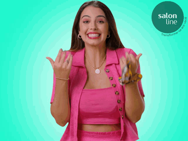 a woman in a pink shirt is smiling in front of a blue background with a salon line logo