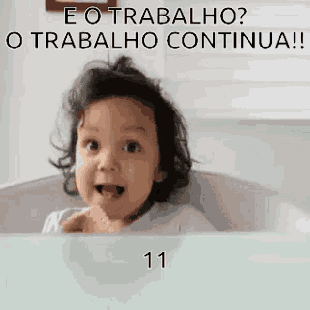 a baby is sitting in a bathtub with the number 11 written on the bottom .