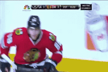 a hockey game is being played and the score is 3 to 2