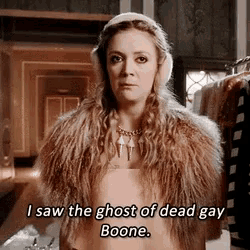 a woman wearing ear muffs and a fur coat says i saw the ghost of dead gay boone