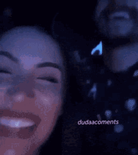 a woman is smiling next to a man with dudaacornents written on the bottom of the image