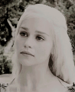 a close up of a woman 's face with blonde hair .