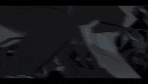 a man in a suit and tie has a shadow on his face
