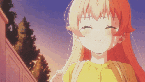 a girl with long red hair is wearing a yellow shirt with buttons