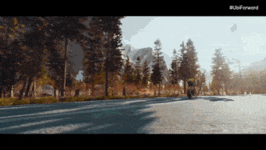 a person riding a bike down a road with the ubi forward logo on the bottom