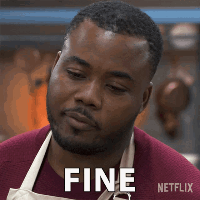 a man wearing an apron is making a face and says fine