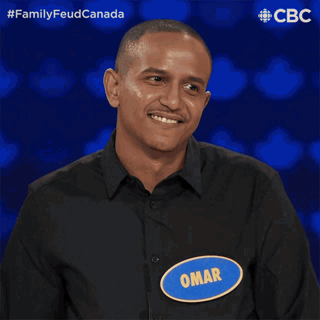 a man with a name tag that says oma on it