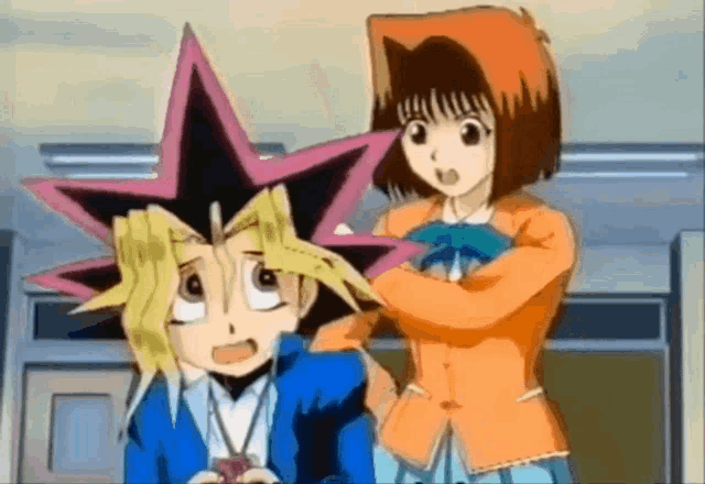a girl is brushing a boy 's hair with a pink star on his head