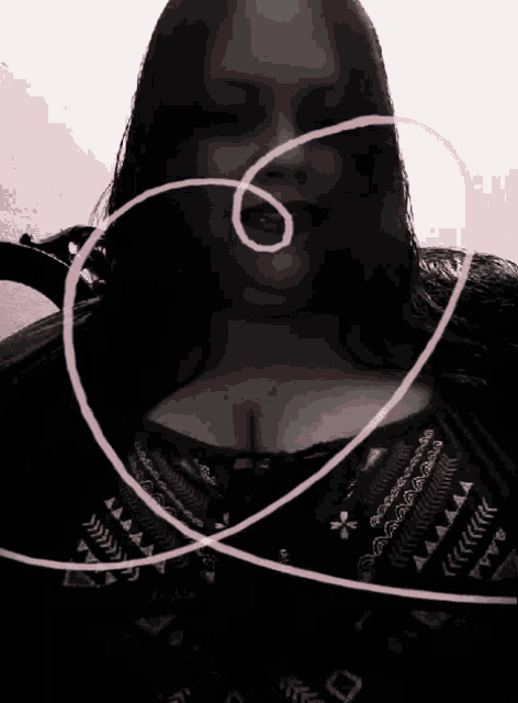 a black and white photo of a woman with a pink heart around her face