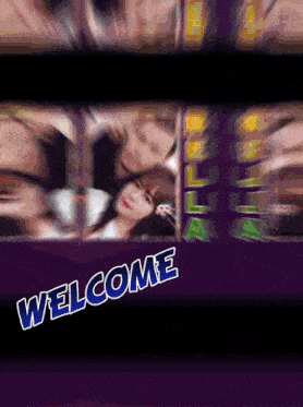 a welcome sign with a blurry picture of a woman
