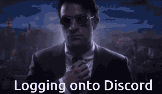 a man in a suit and tie with the words logging onto discord