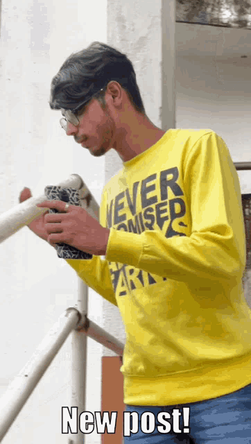 a man wearing a yellow shirt that says " never missed "