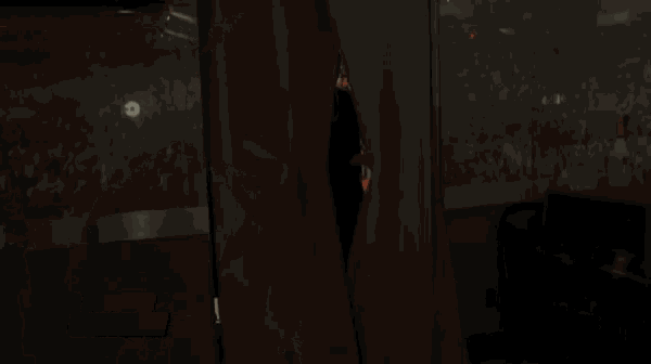 a man standing in a room with a wwe.com exclusive advertisement