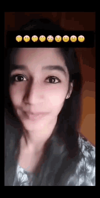 a close up of a woman 's face with smiley faces on it