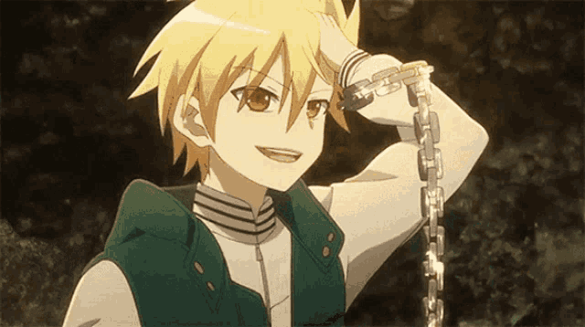 a boy with a chain around his neck is smiling