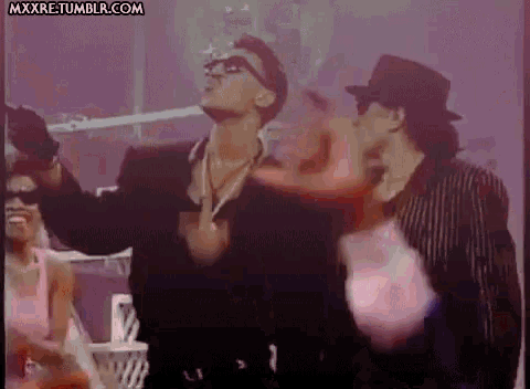 a group of people are dancing in front of a screen that says mxxxre tumblr.com