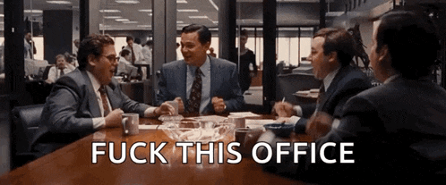 a group of men are sitting around a table with the words " fuck this office " written on the bottom