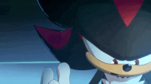 a close up of a shadow the hedgehog 's face with a blue background