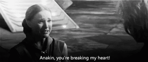 a woman is crying in a black and white photo with the words anakin , you 're breaking my heart .