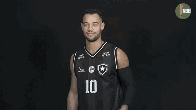 a man wearing a jersey with the number 10 covering his mouth