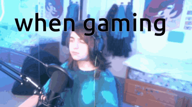 a girl sitting in front of a microphone with the words " when gaming " written above her