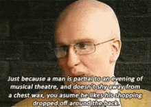 a bald man with glasses and a quote about a man