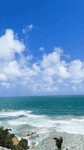 a view of the ocean with waves crashing on the shore