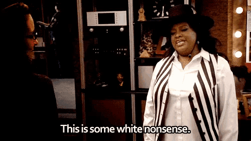 a woman in a striped vest is talking to a man and says " this is some white nonsense "