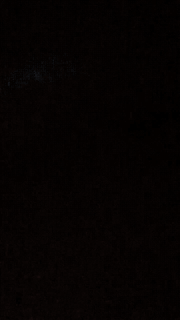 a close up of a gray colored surface with a shadow on it