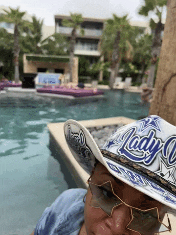 a lady wearing a hat with lady on it