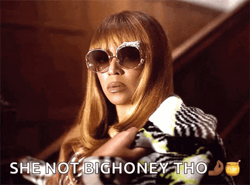 a woman wearing sunglasses has the words she not big honey tho below her