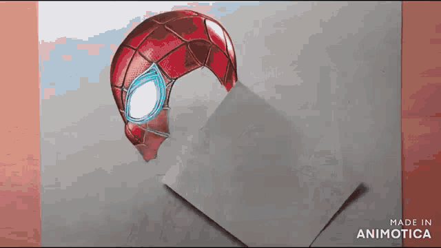 a 3d drawing of a spider-man helmet is coming out of a piece of paper .
