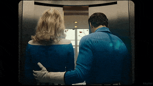 a man and woman are standing in an elevator with the word kepler on the bottom right