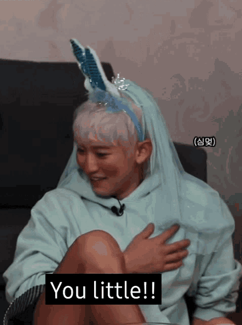 a person wearing bunny ears and a veil says you little