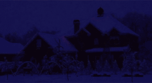 a house is decorated with christmas lights and a star on the roof