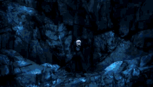 a bright blue light is coming out of a dark cave