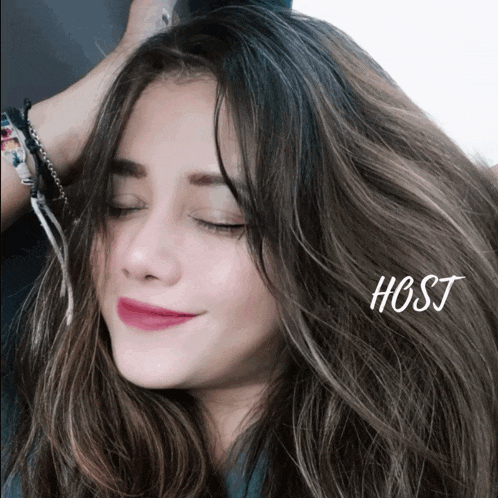 a close up of a woman 's face with her eyes closed and the word host below her