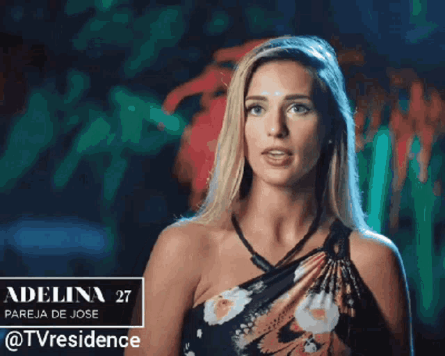 a woman in a floral dress with the name adelina 27