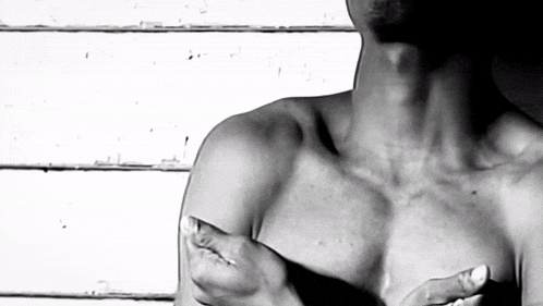 a black and white photo of a man 's chest