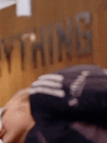 a close up of a person laying on a bed .