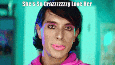 a man with pink lipstick on his face and the words she 's so crazzzzzzy love her above him