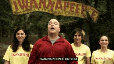 a group of people wearing yellow shirts that say iwannapeepee on them