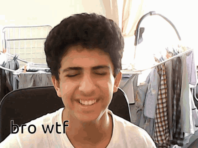 a young man with his eyes closed and the word bro wtf written on his shirt