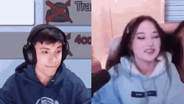 a man and a woman are sitting in front of a microphone .