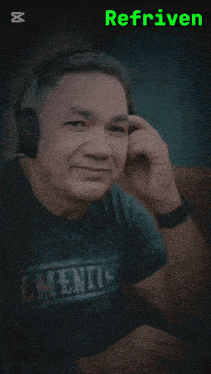 a man wearing headphones and a shirt which says elements