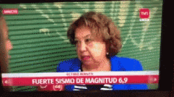 a tv screen shows a woman on a news channel