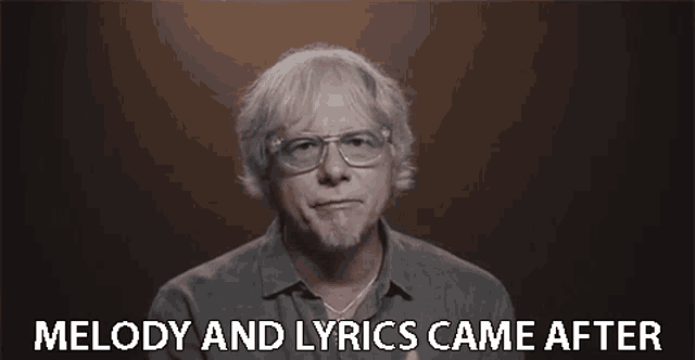 a man with glasses and a beard says melody and lyrics came after .