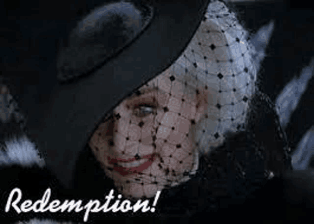 a woman wearing a black hat and veil is smiling and looking at the camera .