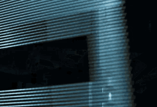 a blurred image of a building with a window