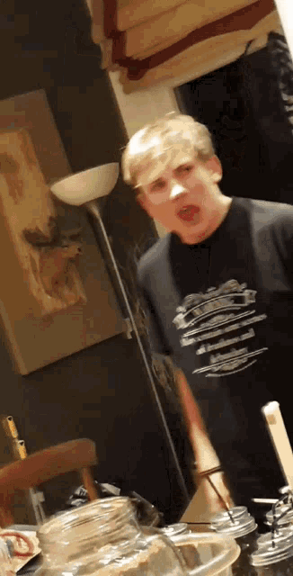 a man wearing a t-shirt that says ' i 'm sorry i 'm sorry ' on it